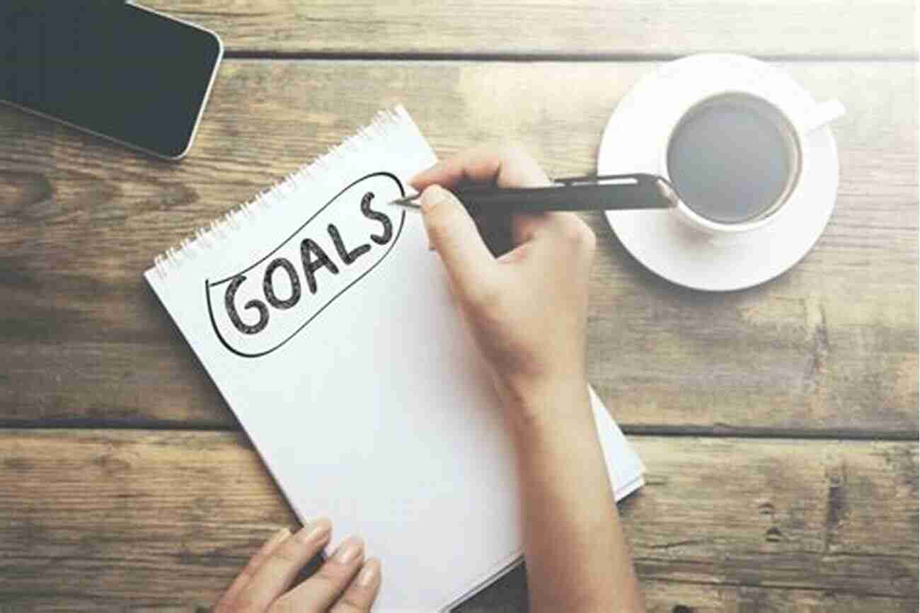 A Person Writing Down Their Goals And Priorities Becoming Unstuck: The Essential Guide To Always Know The Next Step For You