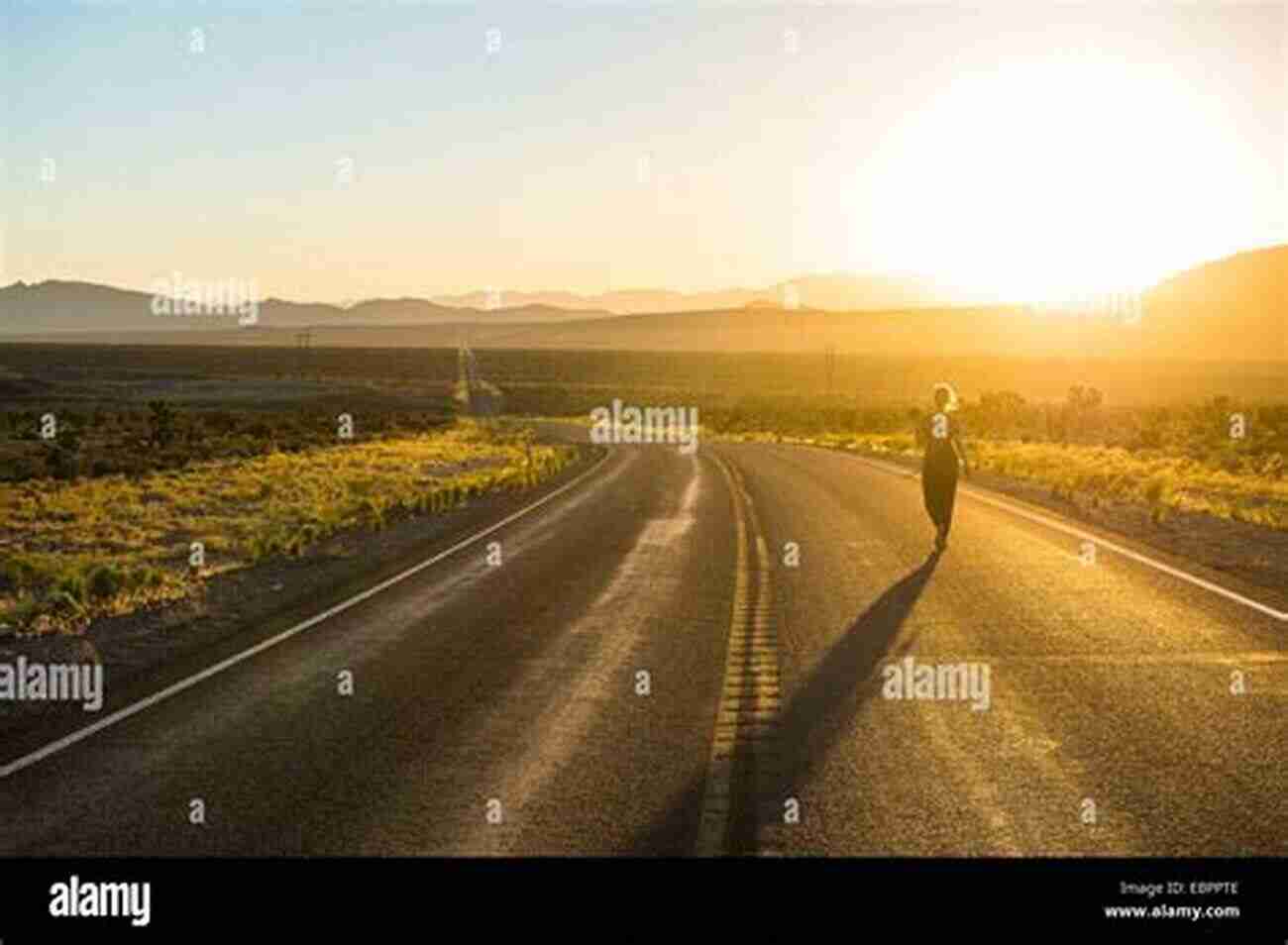 Couple Walking On A Winding Road Towards The Sunset, Symbolizing The Challenges And Rewards Of Romantic Relationships The Rocky Road To Romance