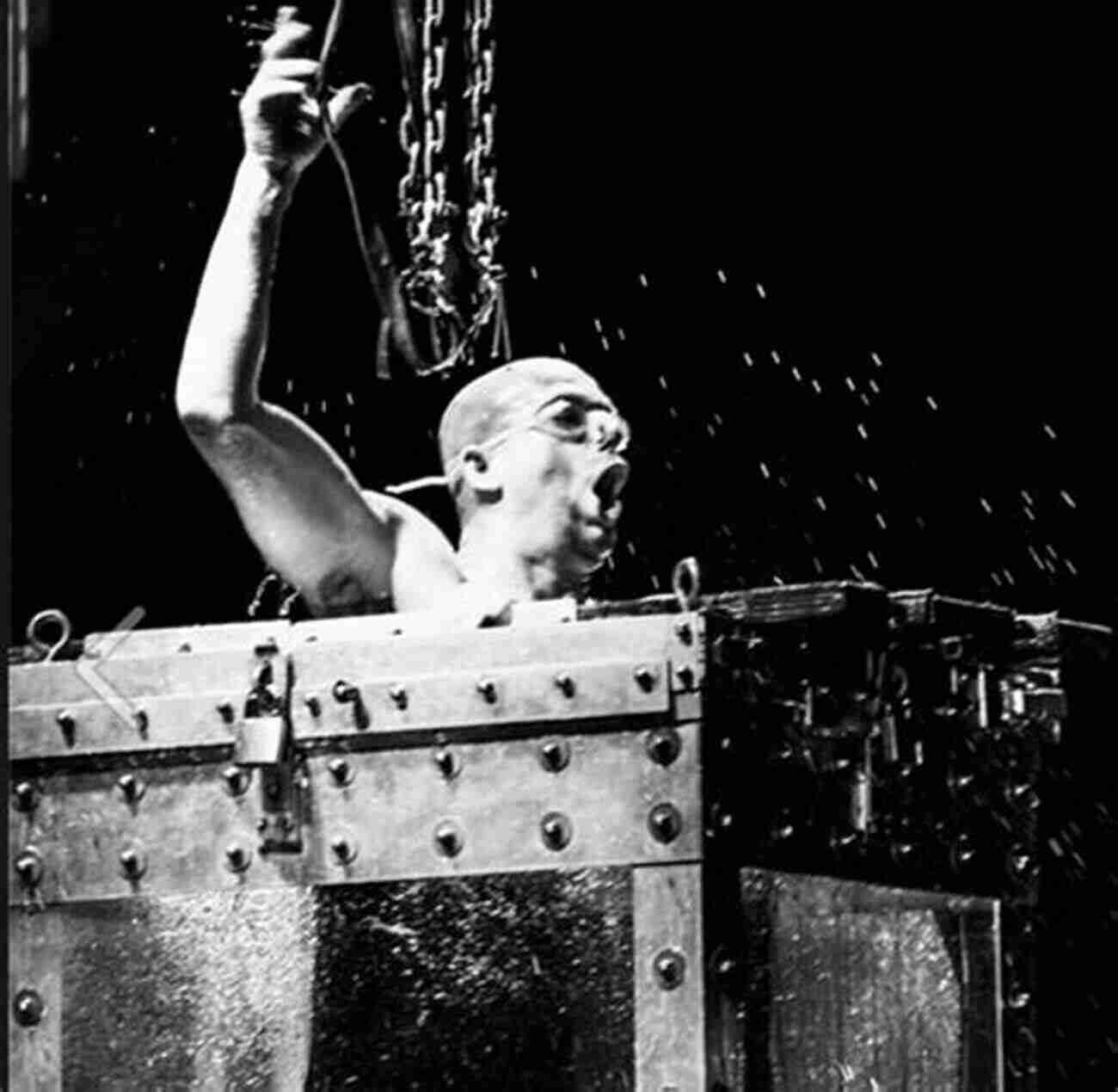 Rick Wood Performing The Water Torture Cell, His Signature Death Defying Escape Act The Human Snare Rick Wood