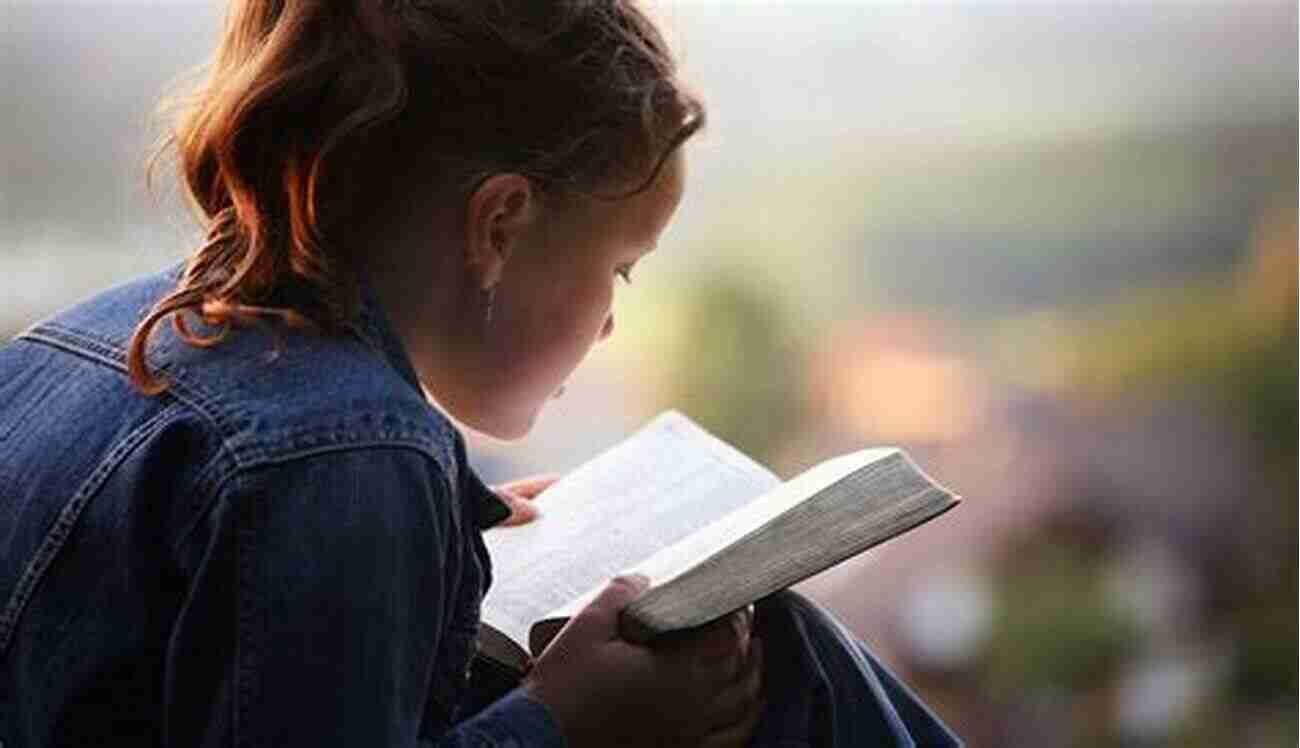 Young Woman Reading Her Bible On A Peaceful Hillside A Young Woman S Guide To Discovering Her Bible